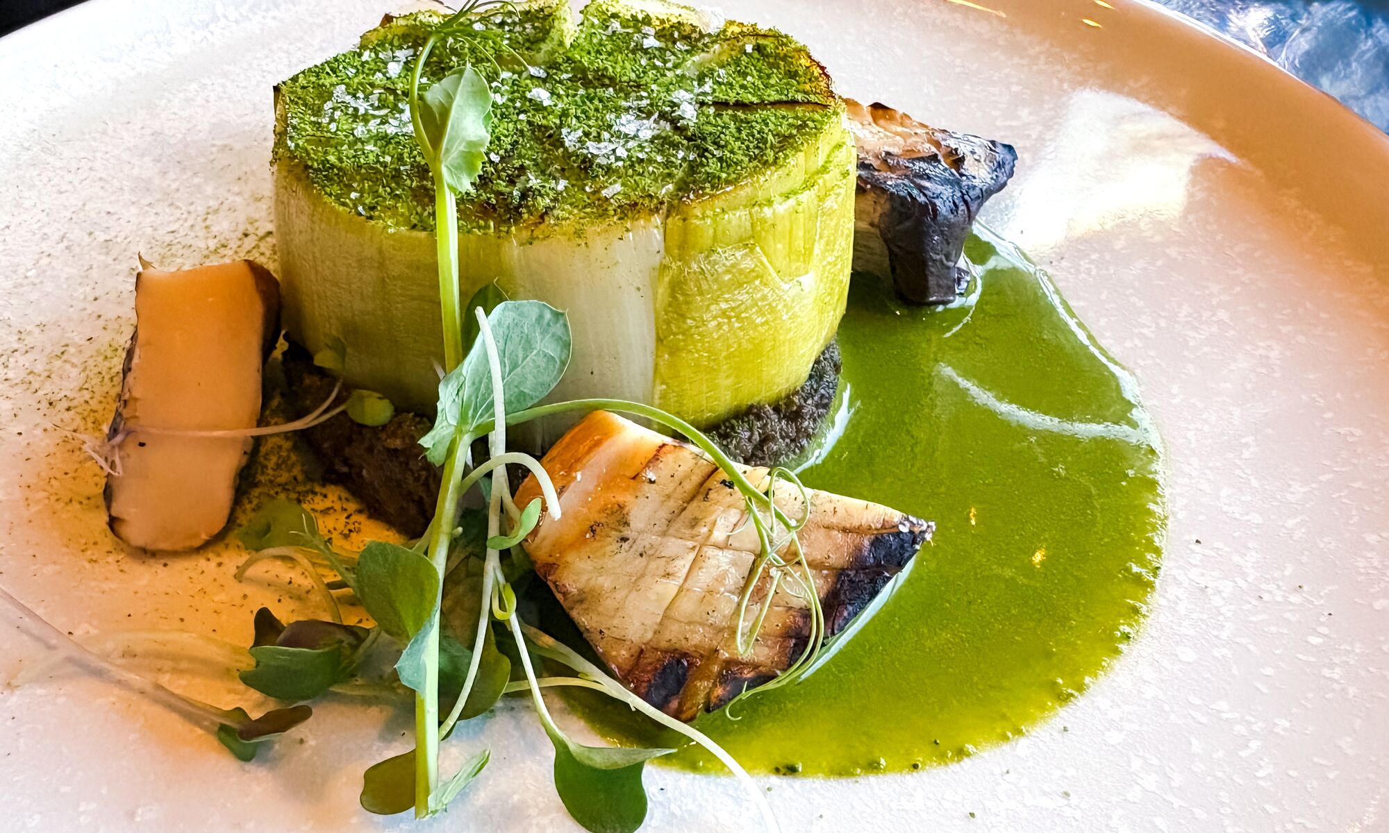 Grilled Leek Medallion on Stuffed Mushroom Pate at Juniper Bistro in Banff National Park.